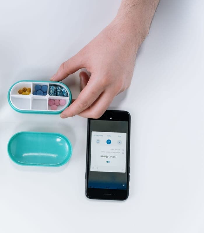 A person checking their medication schedule on their phone